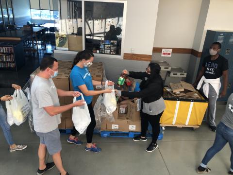 Volunteers preparing school bags