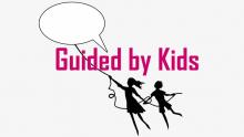 Two children flying an idea bubble kite.