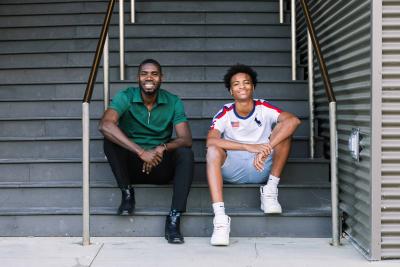 100 Black Men of Omaha mentor and mentee siting on steps